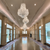 Crystal chandeliers handing from a ceiling of a lobby.